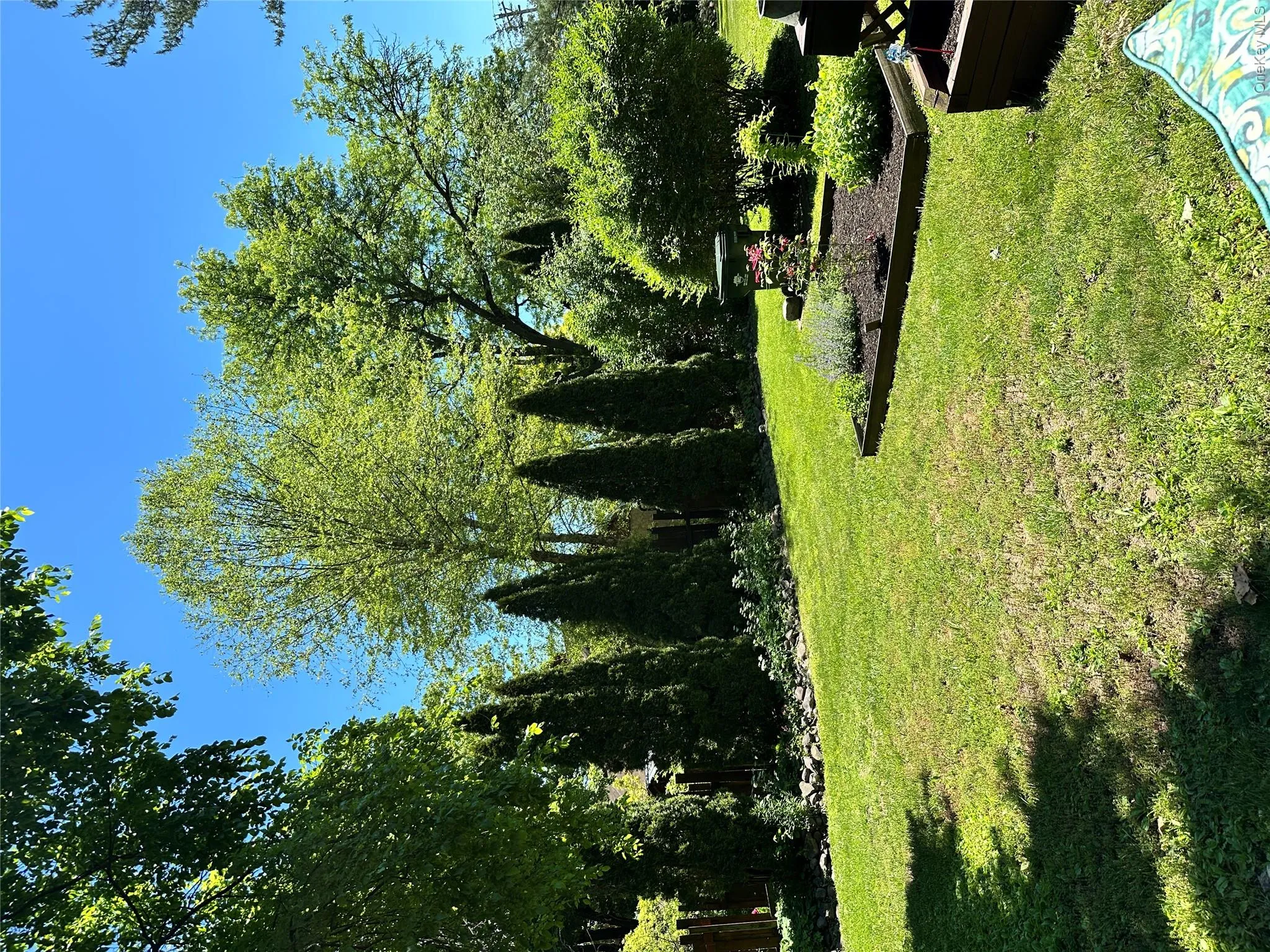 side yard with mature perennials throughout property side yard with mature perennials throughout property