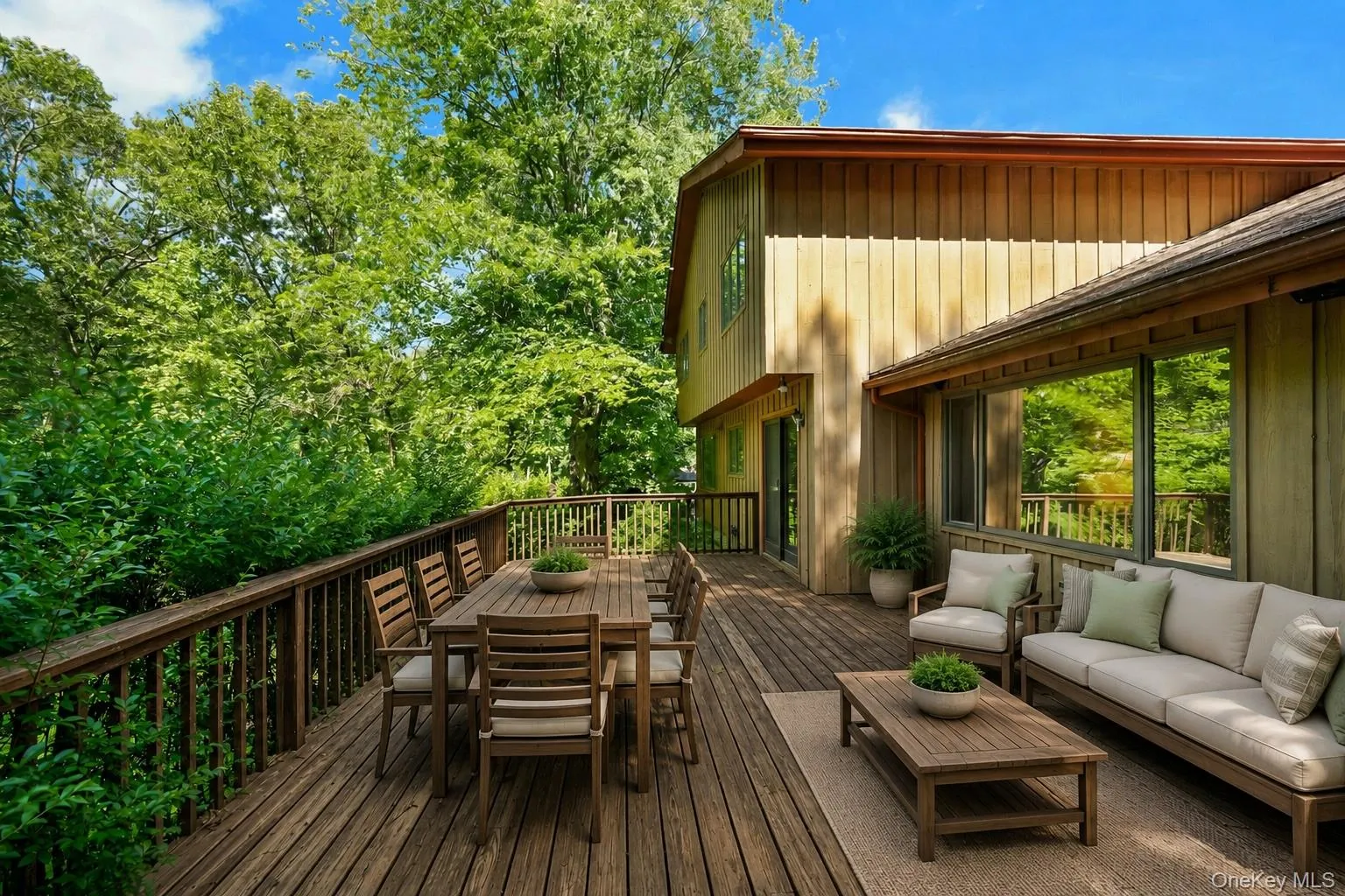 Sizable deck with access from kitchen and family room - virtually staged. Sizable deck with access from kitchen and family room - virtually staged.