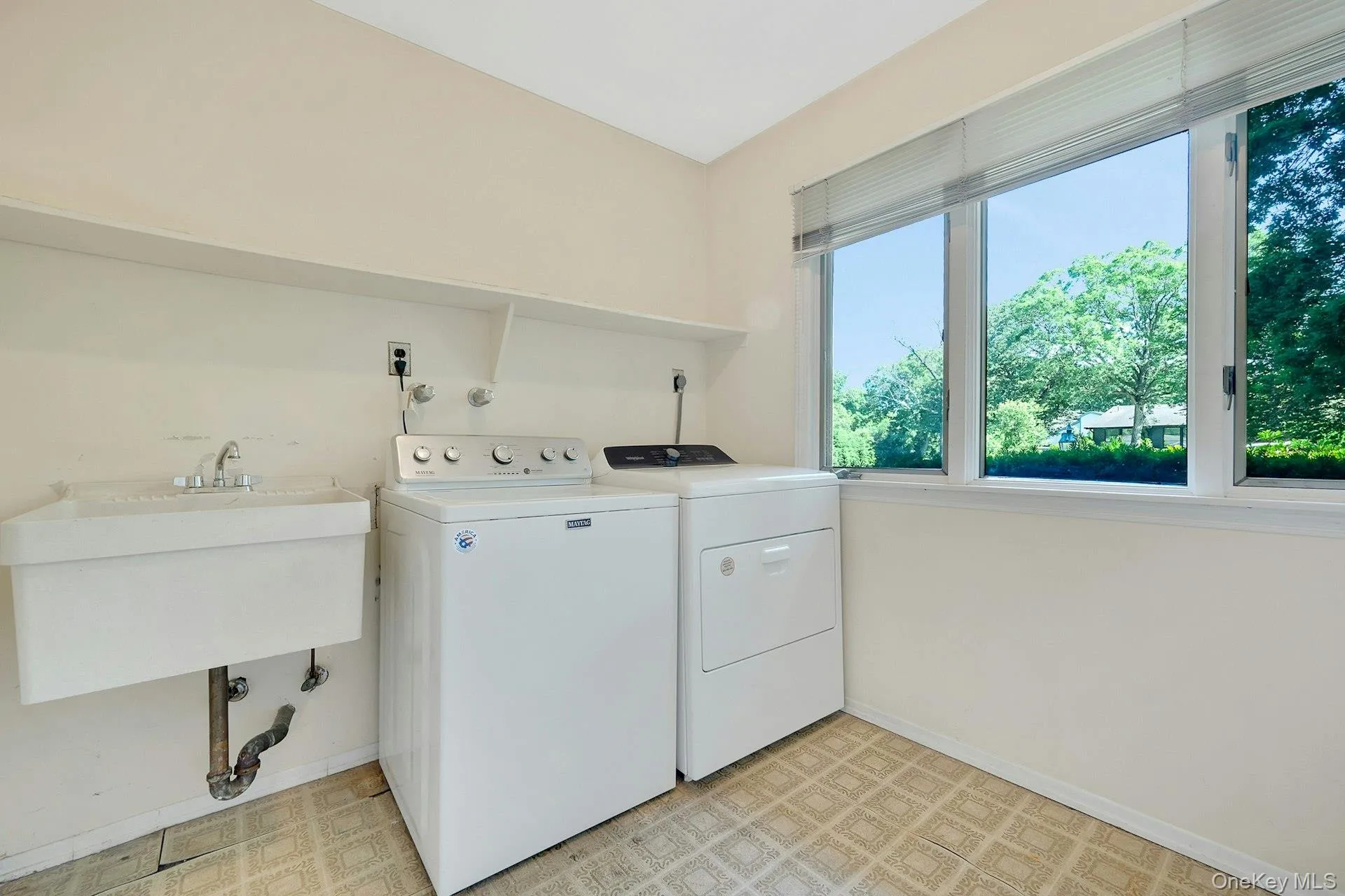 Laundry and mud area located off two car garage. Laundry and mud area located off two car garage.