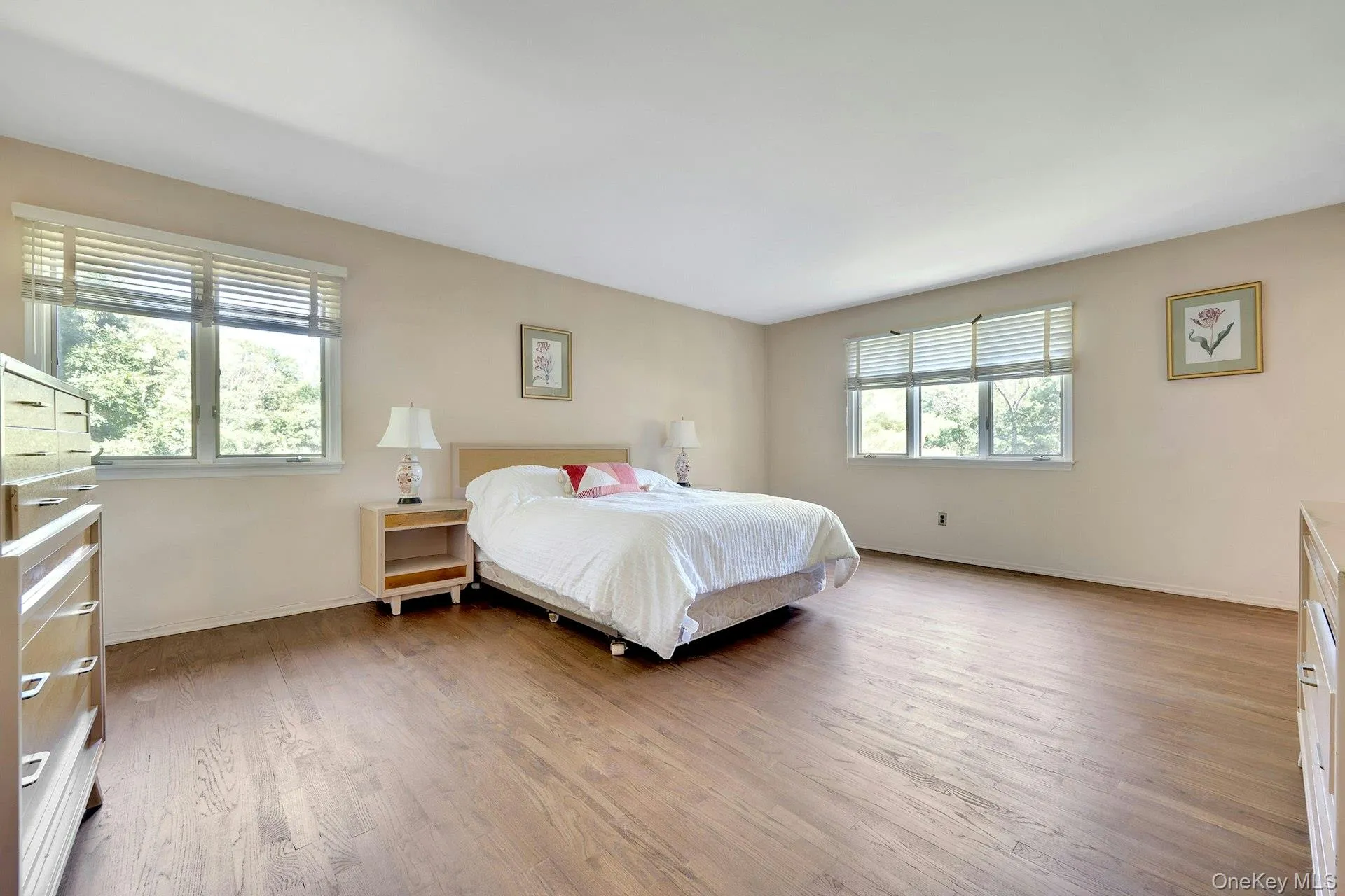 Sizable primary bedroom with two walk-in closets. Sizable primary bedroom with two walk-in closets.