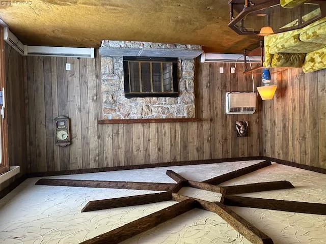 Woodburning fireplace, slider to yard, entrance to basement Woodburning fireplace, slider to yard, entrance to basement