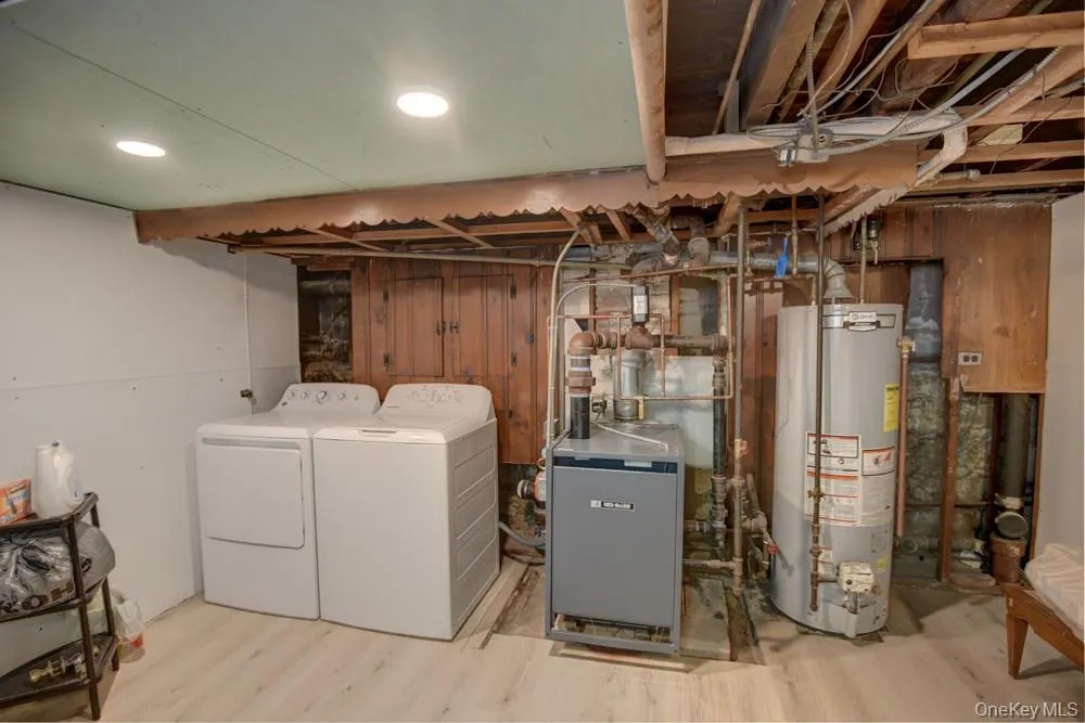 Laundry area & gas burner with hot water heater Laundry area & gas burner with hot water heater