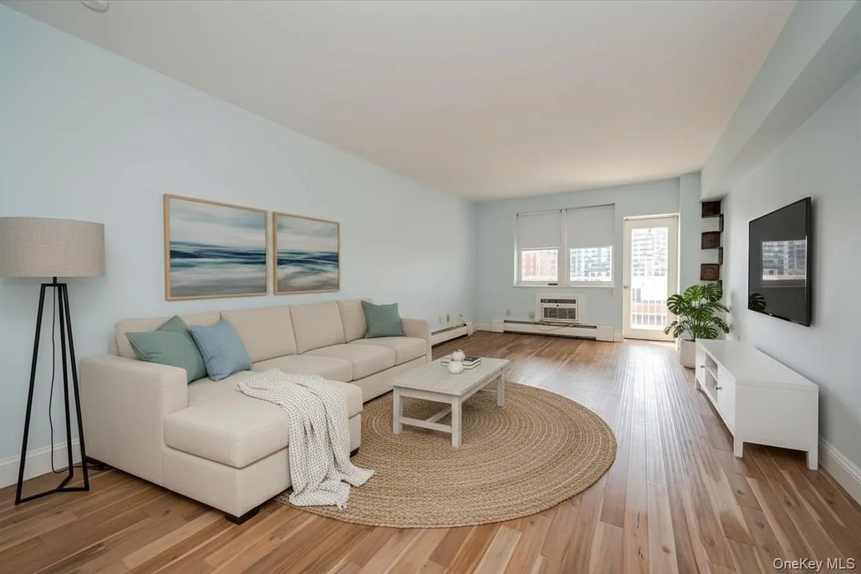Spacious living area featuring light wood-finish flooring, AI Staging Spacious living area featuring light wood-finish flooring, AI Staging