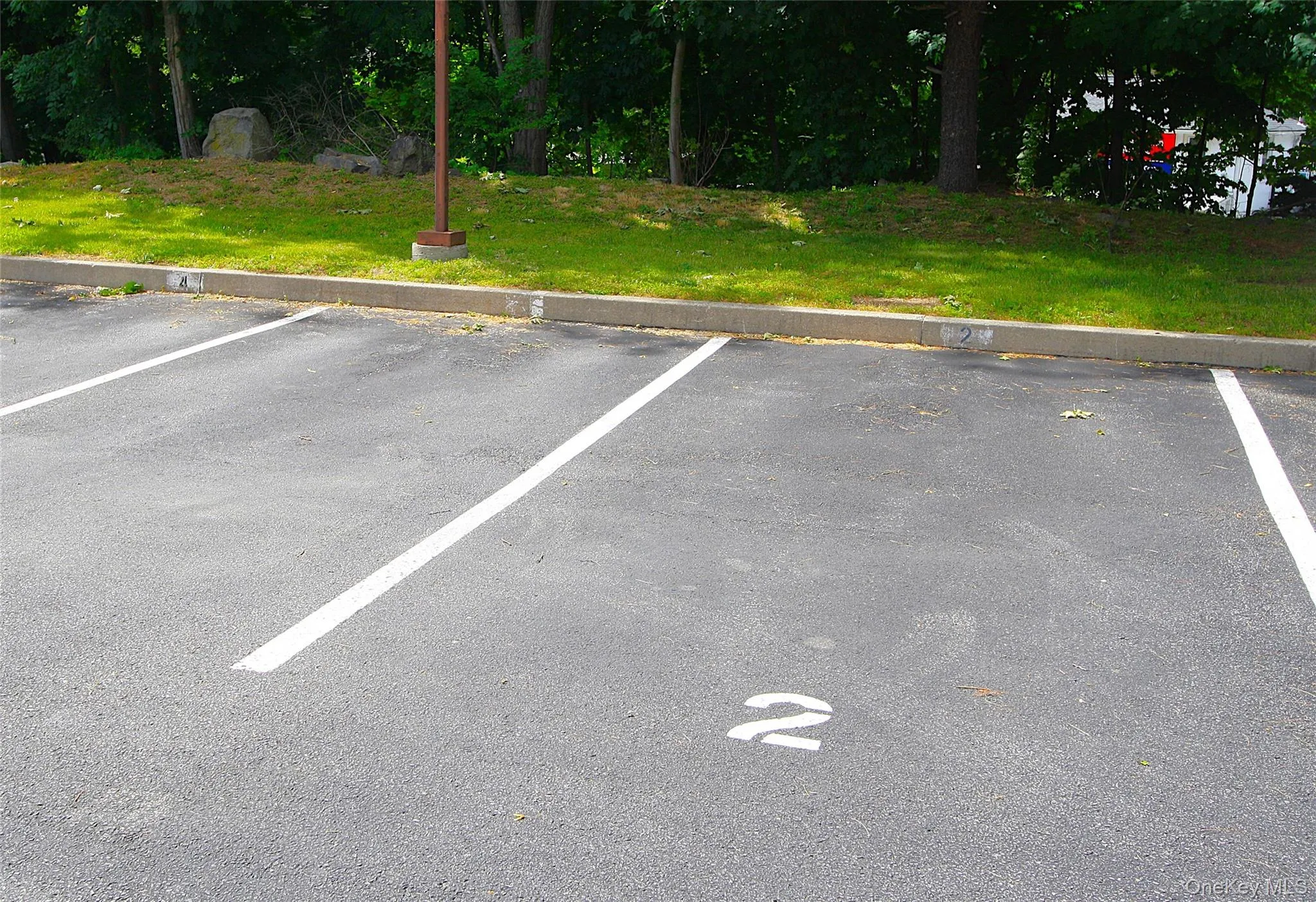 Spot # 2 is all yours, and located handily close to the unit. There is overflow parking space as well. Spot # 2 is all yours, and located handily close to the unit. There is overflow parking space as well.