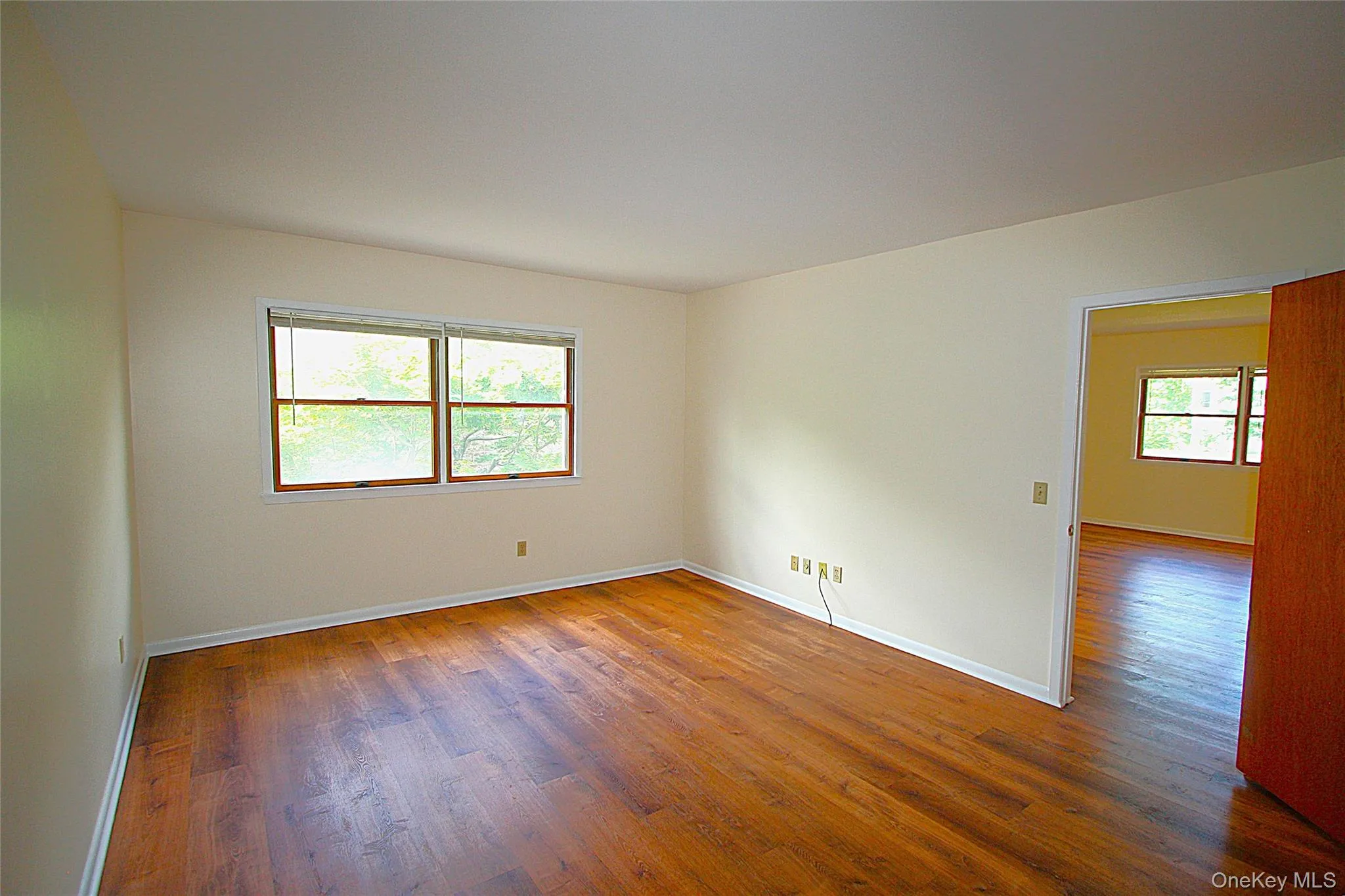 The deep bedroom has large windows looking down to the tree lined courtyard. The deep bedroom has large windows looking down to the tree lined courtyard.