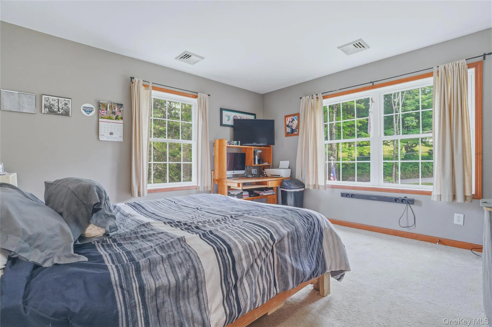 Bedroom with grey walls and grey carpet Bedroom with grey walls and grey carpet