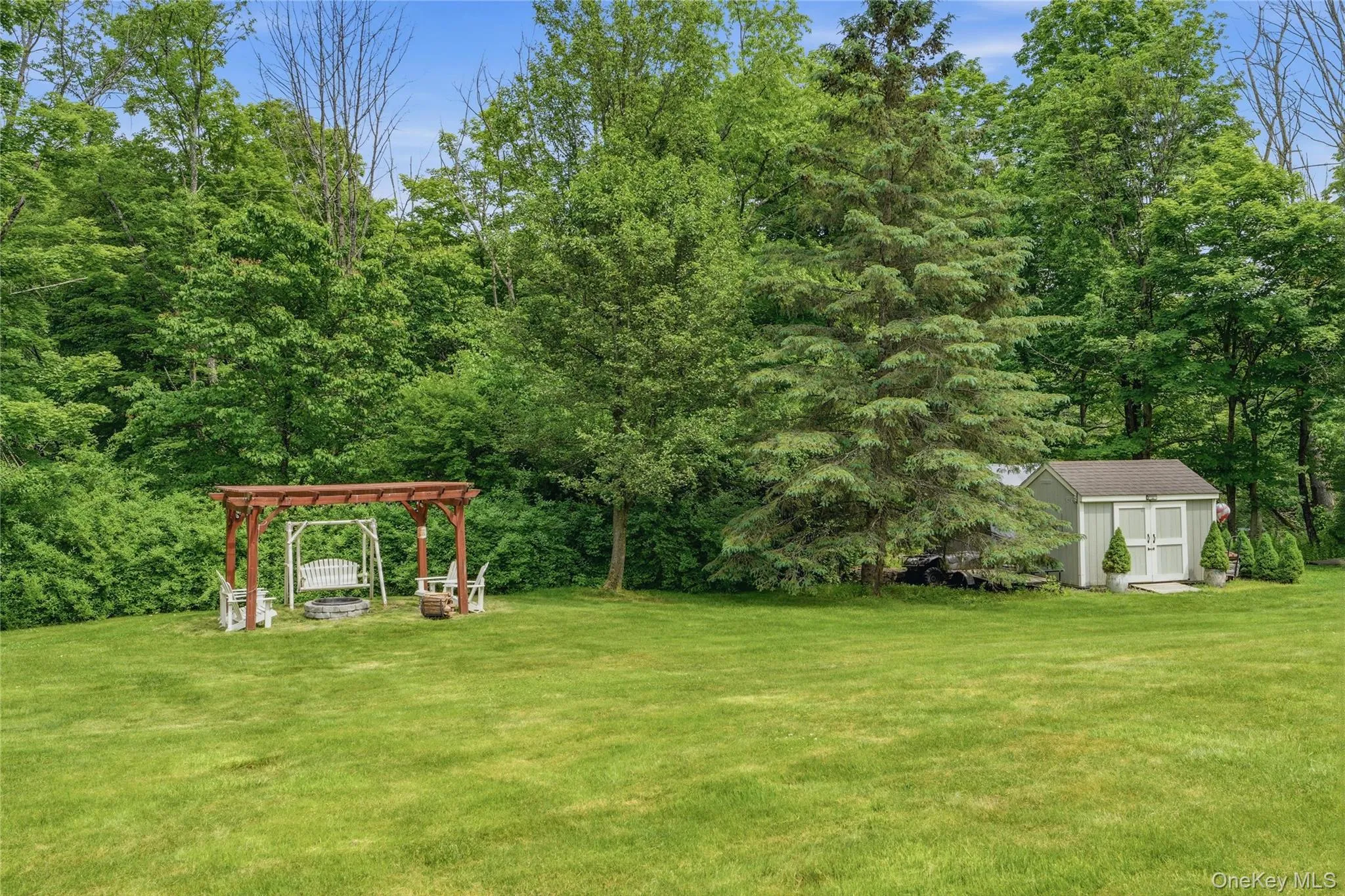 Backyard with fire pit and shed Backyard with fire pit and shed