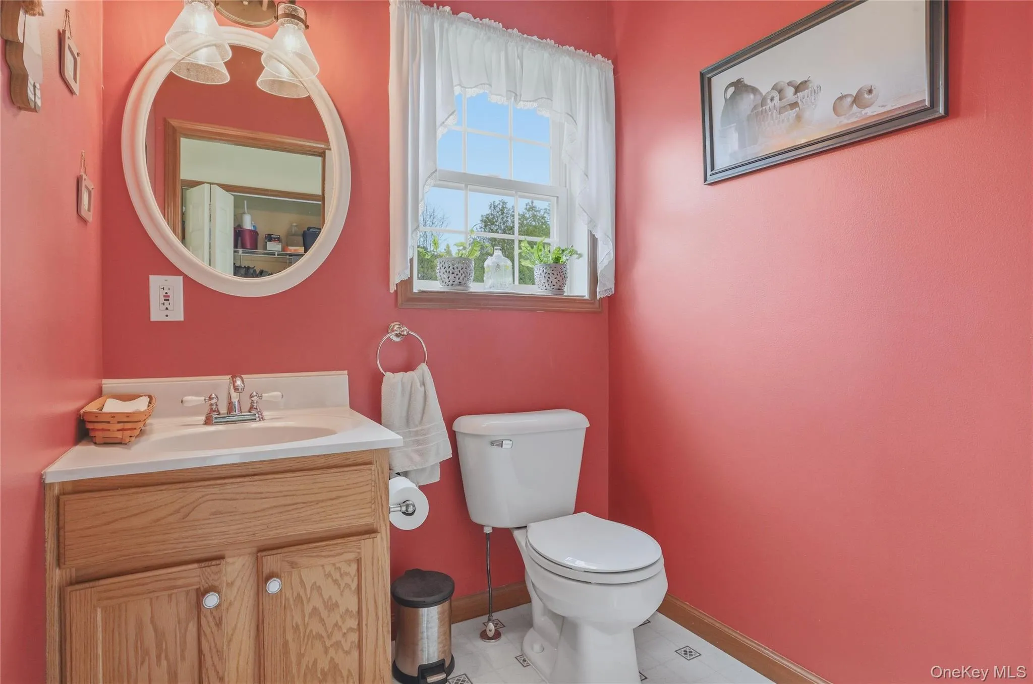 Half bath with coral walls Half bath with coral walls