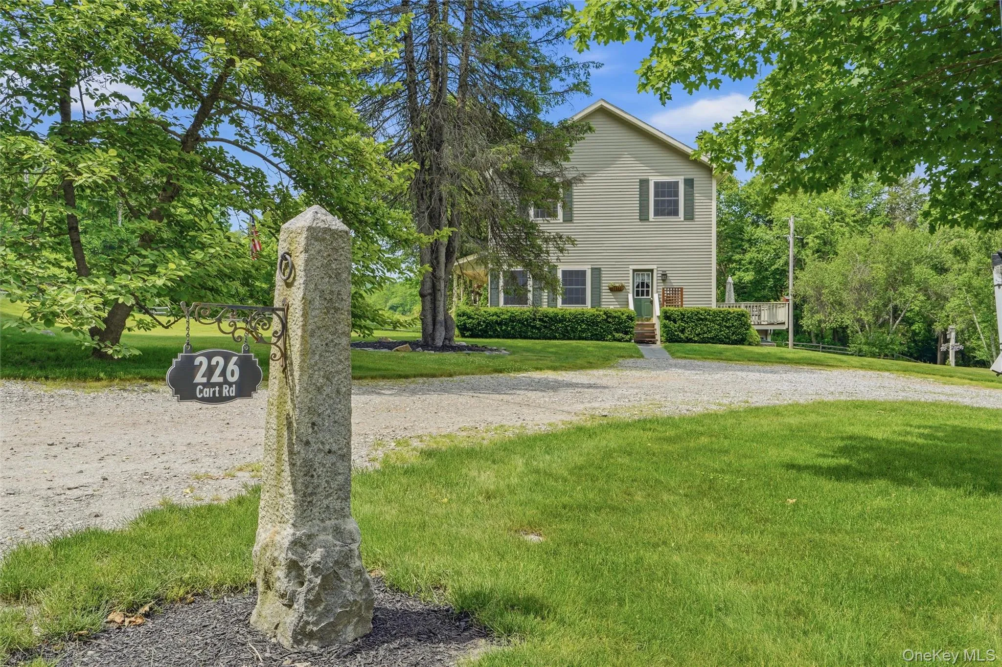 Yard and stone driveway with Yard and stone driveway with