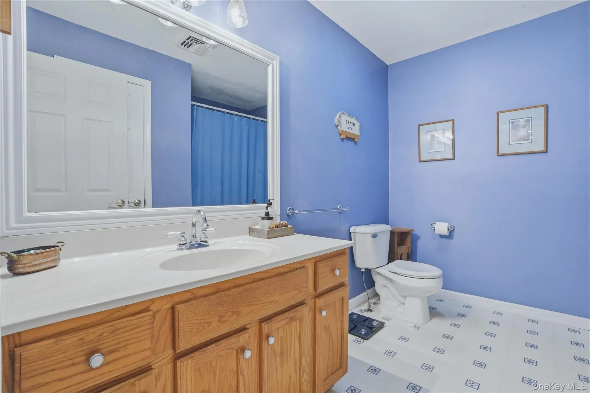 Hall bath with shower and light blue walls Hall bath with shower and light blue walls