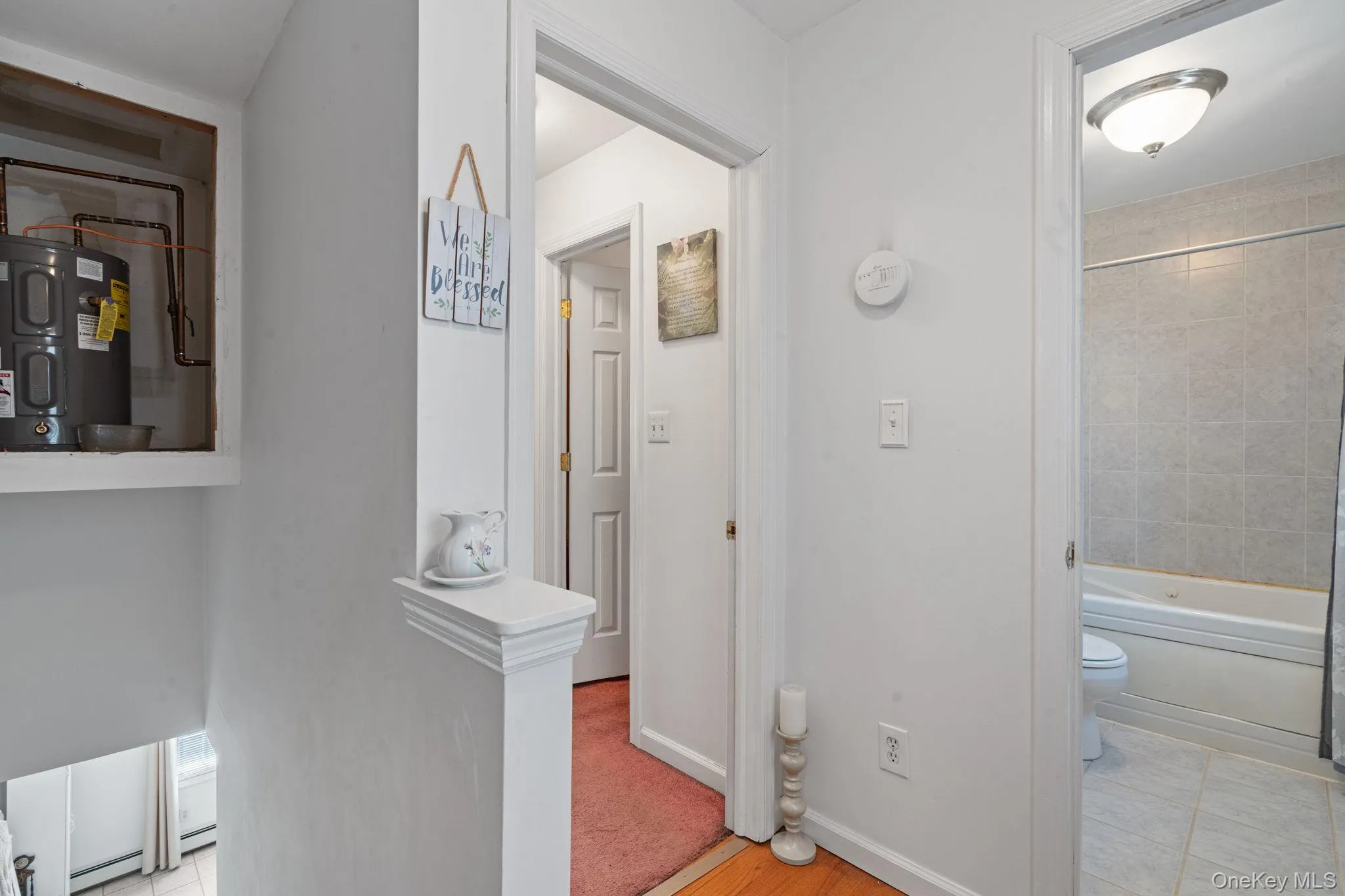 Walk space to bathroom and stairs leading to kitchen and family area Walk space to bathroom and stairs leading to kitchen and family area