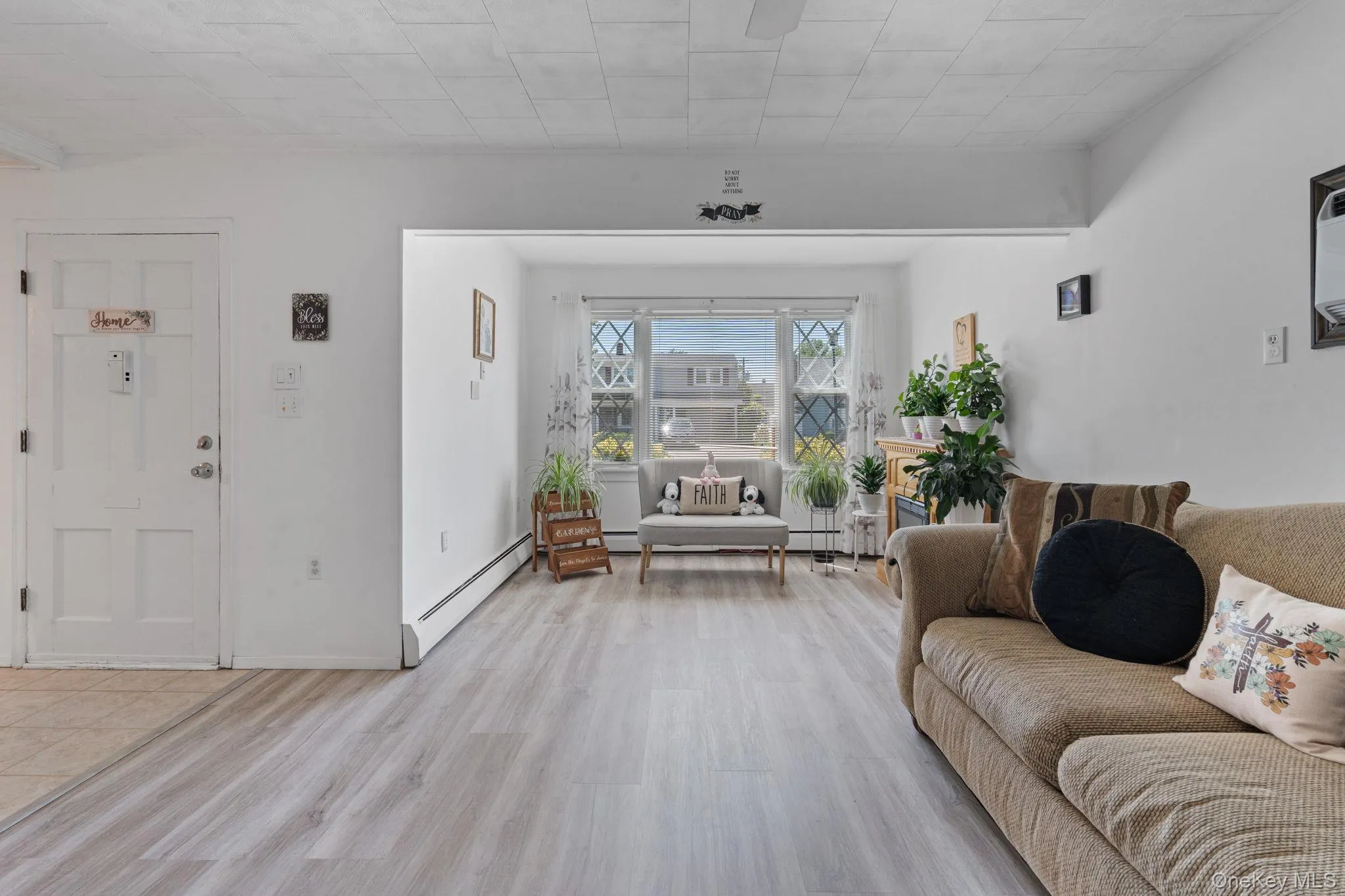 Open-concept living space with light wood-finish flooring Open-concept living space with light wood-finish flooring