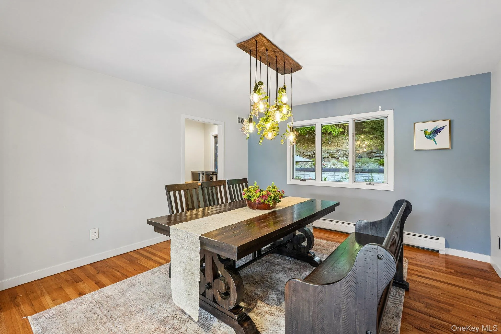 A dining area with views of the backyard. A dining area with views of the backyard.