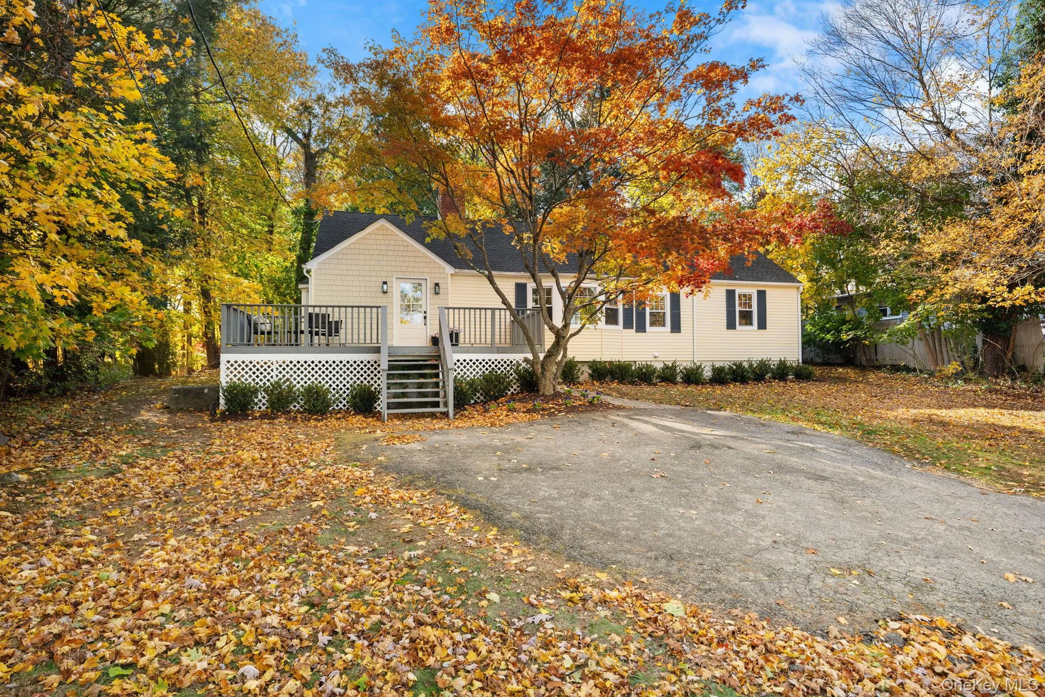 Charming front elevation framed by mature trees and crisp landscaping, offering the perfect blend of privacy and warmth. Charming front elevation framed by mature trees and crisp landscaping, offering the perfect blend of privacy and warmth.