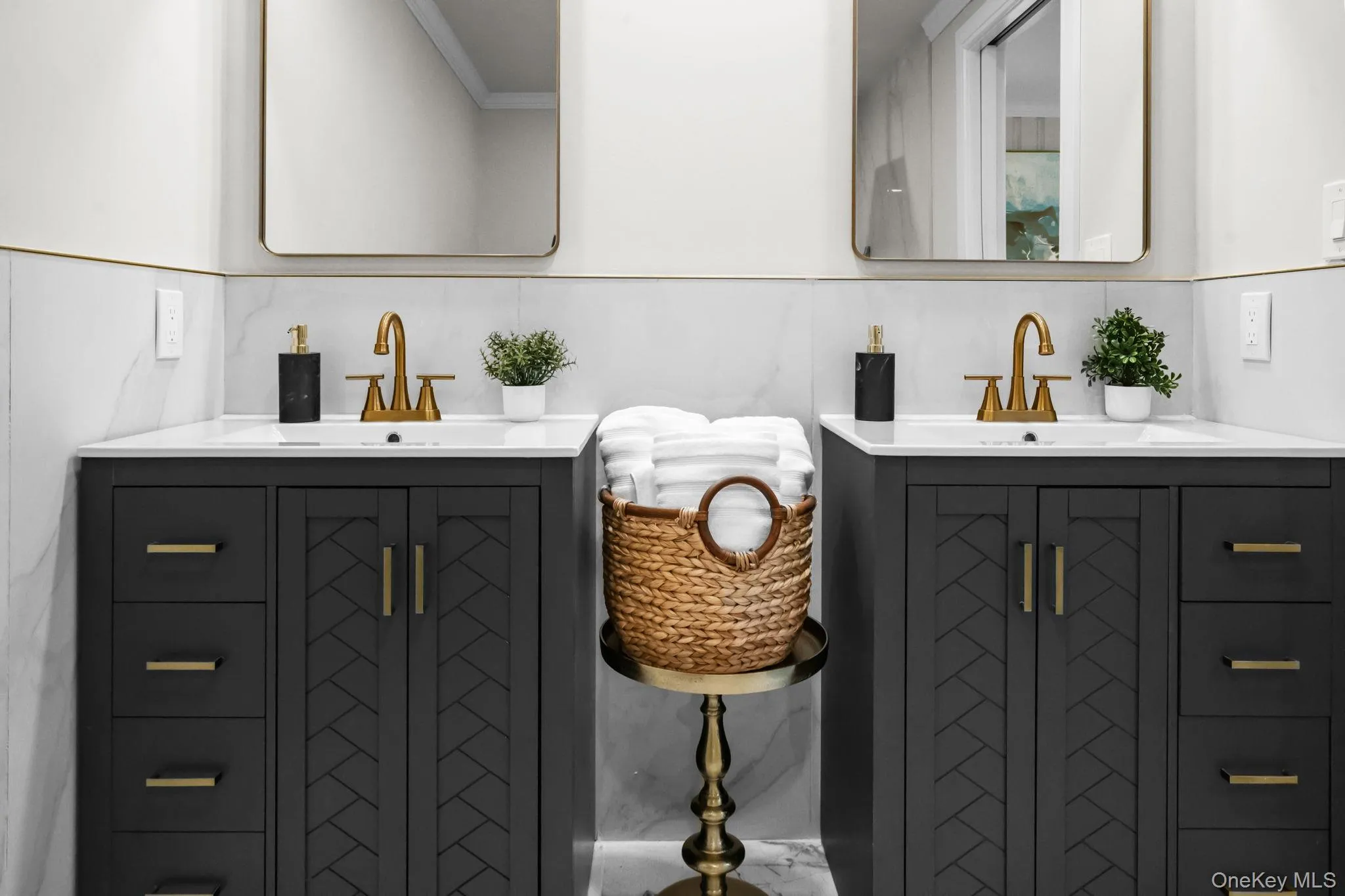 Custom cabinetry and coordinated finishes combine style and functionality in this beautifully renovated ensuite. Custom cabinetry and coordinated finishes combine style and functionality in this beautifully renovated ensuite.