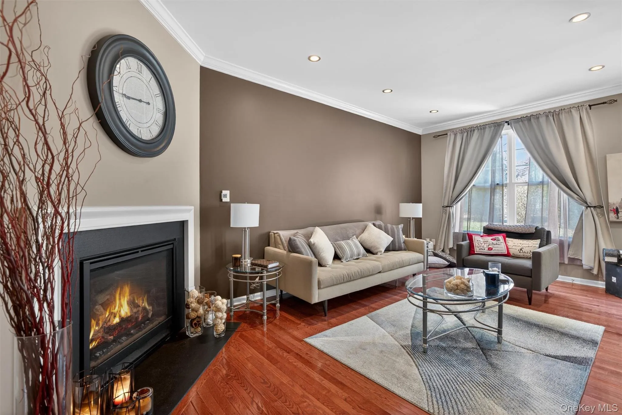 Warm, inviting living room with gas fireplace complete with thermostat and heat vent Warm, inviting living room with gas fireplace complete with thermostat and heat vent