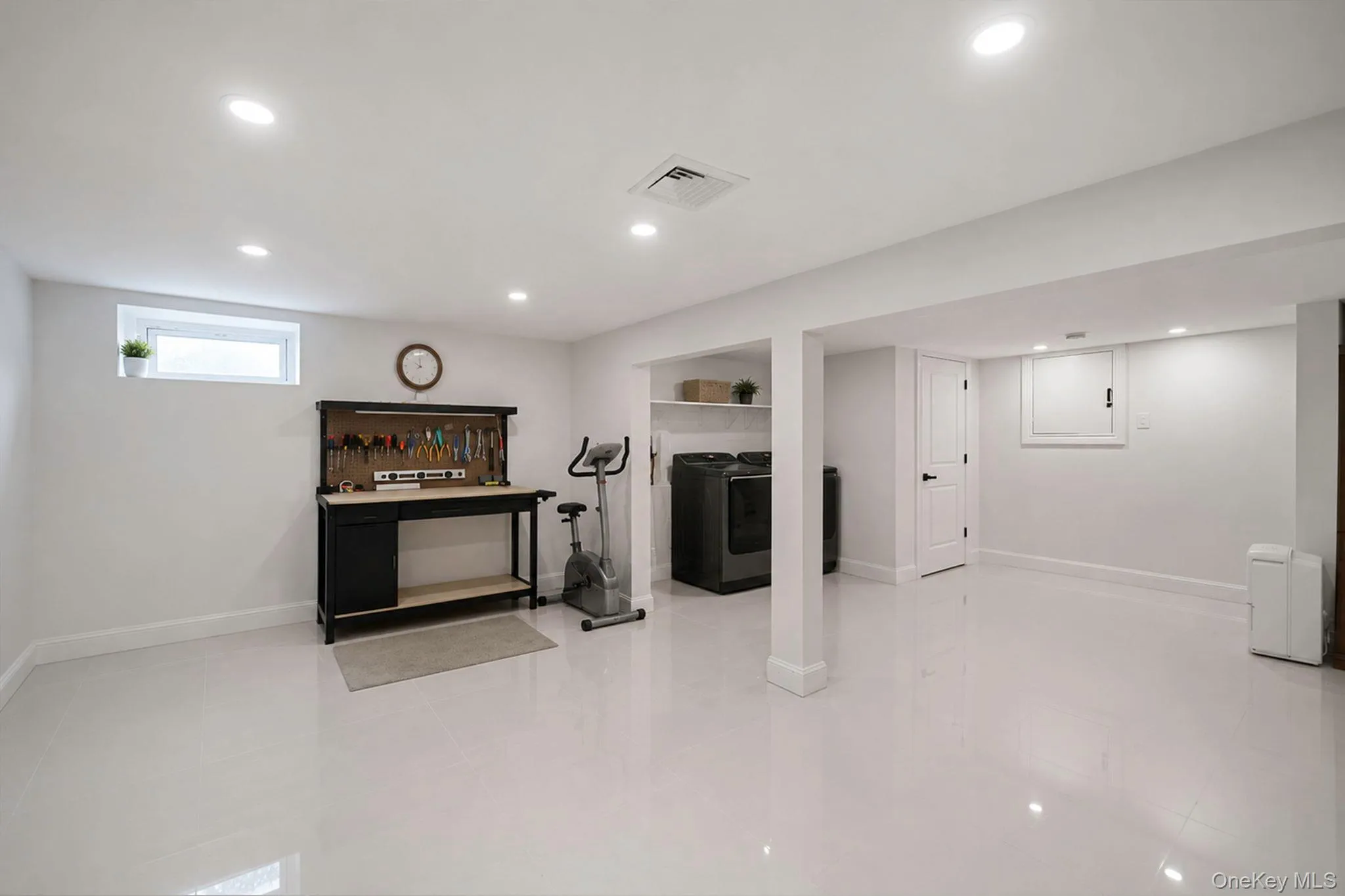 Partial, finished basement with laundry area, storage closets, recessed lighting, tile floors Partial, finished basement with laundry area, storage closets, recessed lighting, tile floors
