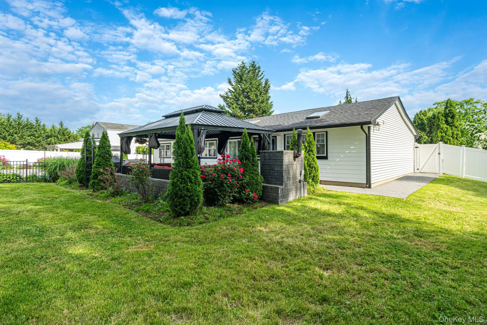 Fully fenced, landscaped backyard Fully fenced, landscaped backyard
