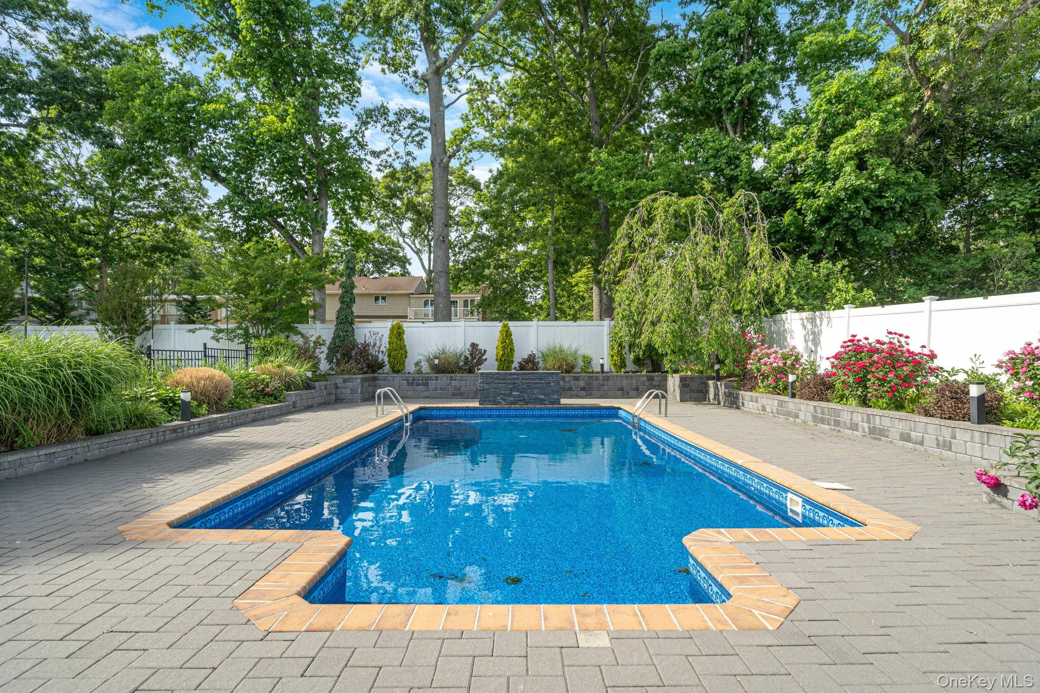 Inground salt water pool with lights and a fountain, expanded brick pool deck, beautiful landscaping, and shed. Inground salt water pool with lights and a fountain, expanded brick pool deck, beautiful landscaping, and shed.