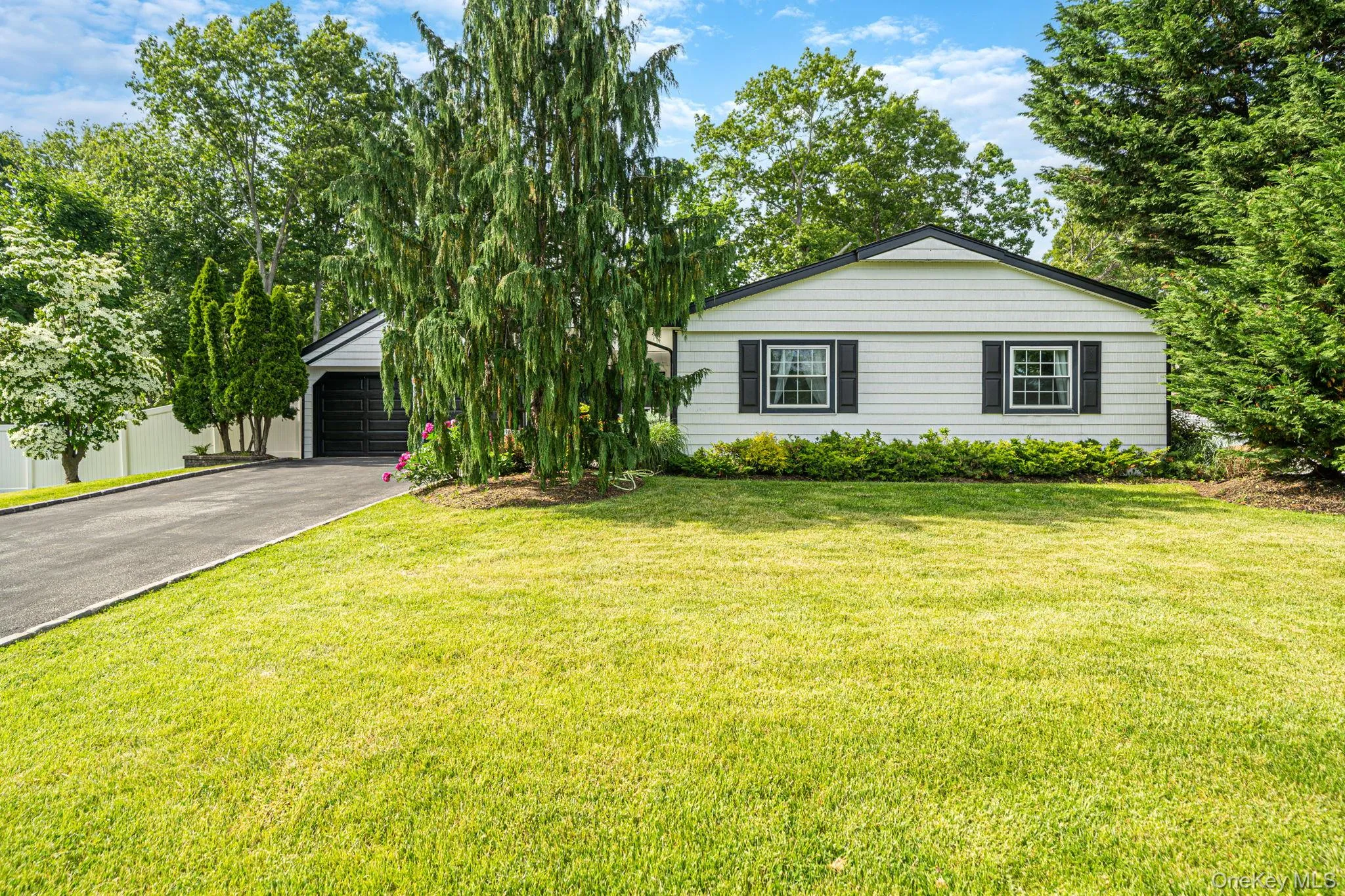 Large front lawn with inground sprinklers. Large front lawn with inground sprinklers.