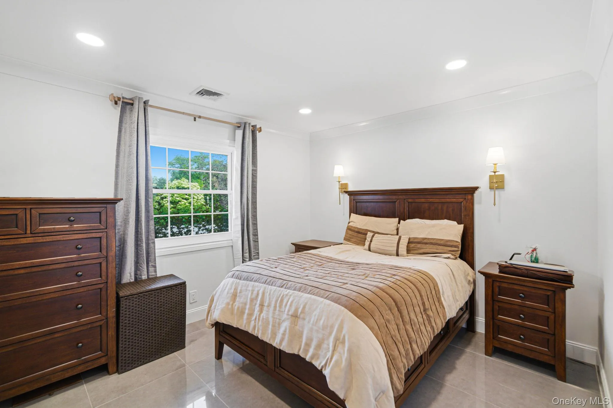Bedroom features recessed lighting, porcelain tile floors, a custom full wall deep closet. Bedroom features recessed lighting, porcelain tile floors, a custom full wall deep closet.