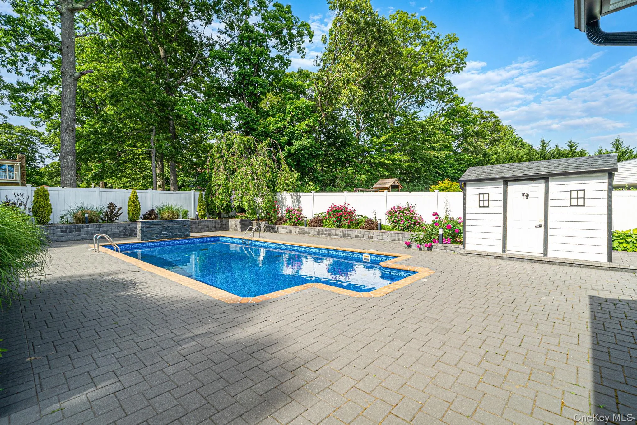 Inground pool, expanded brick pool deck, beautiful landscaping, and shed. Inground pool, expanded brick pool deck, beautiful landscaping, and shed.