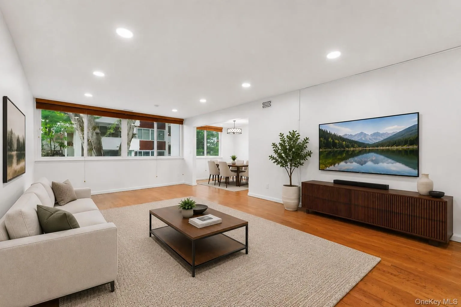 *Virtually Staged* Living Room Features: Dimming Recessed Lighting with Luminosity Switches, Hardwood Floors, Wall-to-Wall Windows, Entrance to Balcony *Virtually Staged* Living Room Features: Dimming Recessed Lighting with Luminosity Switches, Hardwood Floors, Wall-to-Wall Windows, Entrance to Balcony