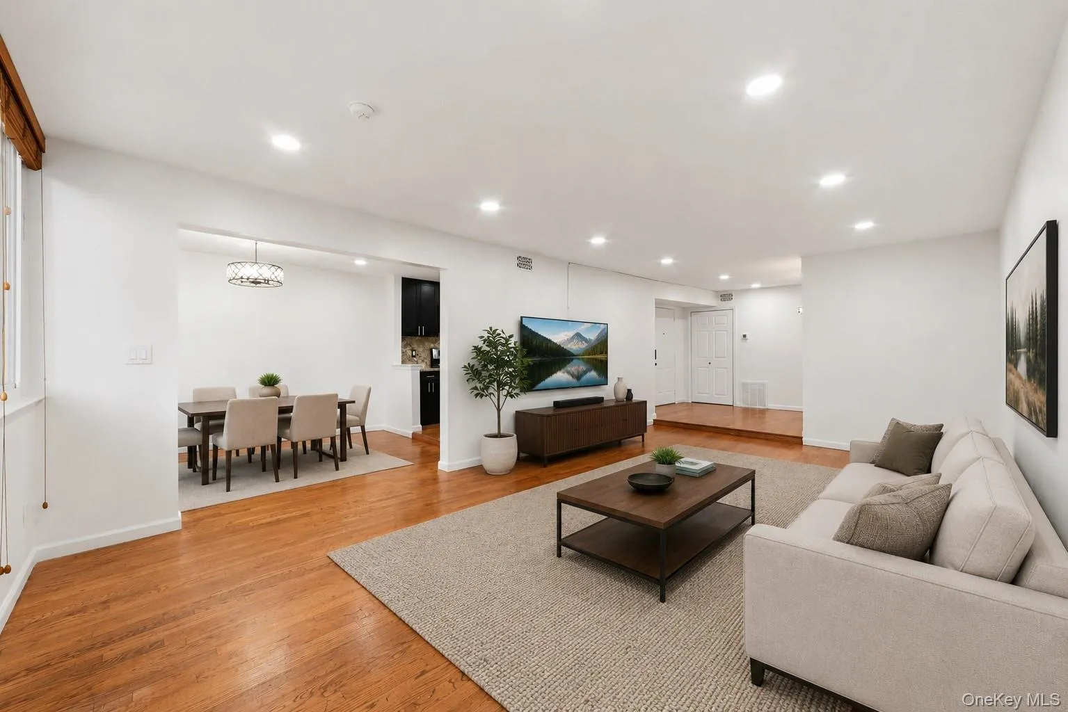 *Virtually Staged* Living Room Features: Dimming Recessed Lighting with Luminosity Switches, Hardwood Floors, Wall-to-Wall Windows, Entrance to Balcony *Virtually Staged* Living Room Features: Dimming Recessed Lighting with Luminosity Switches, Hardwood Floors, Wall-to-Wall Windows, Entrance to Balcony