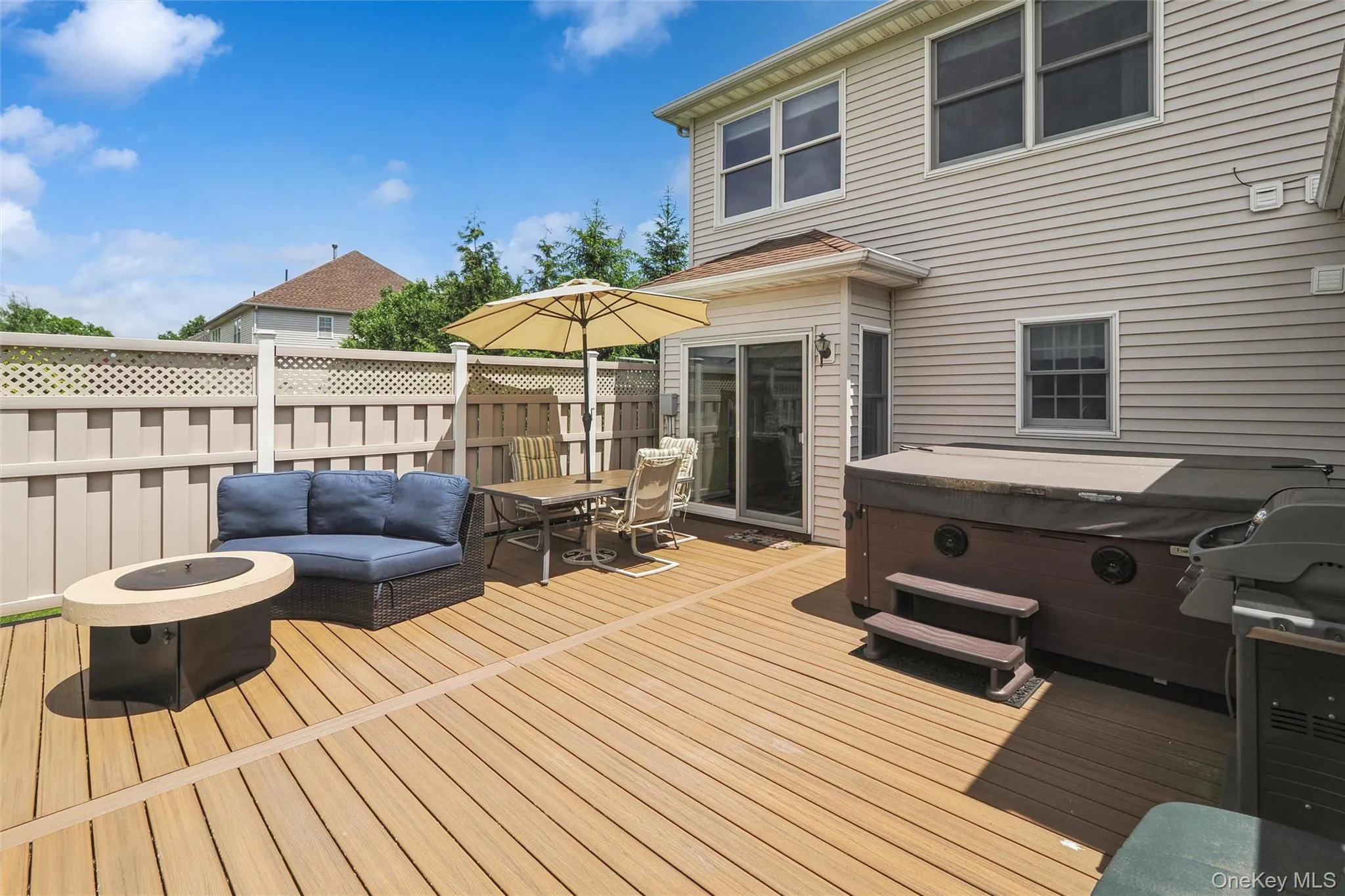 Hot tub, SGD doors from EIK and firepit. Wonderful area for entertaining or just relaxing Hot tub, SGD doors from EIK and firepit. Wonderful area for entertaining or just relaxing