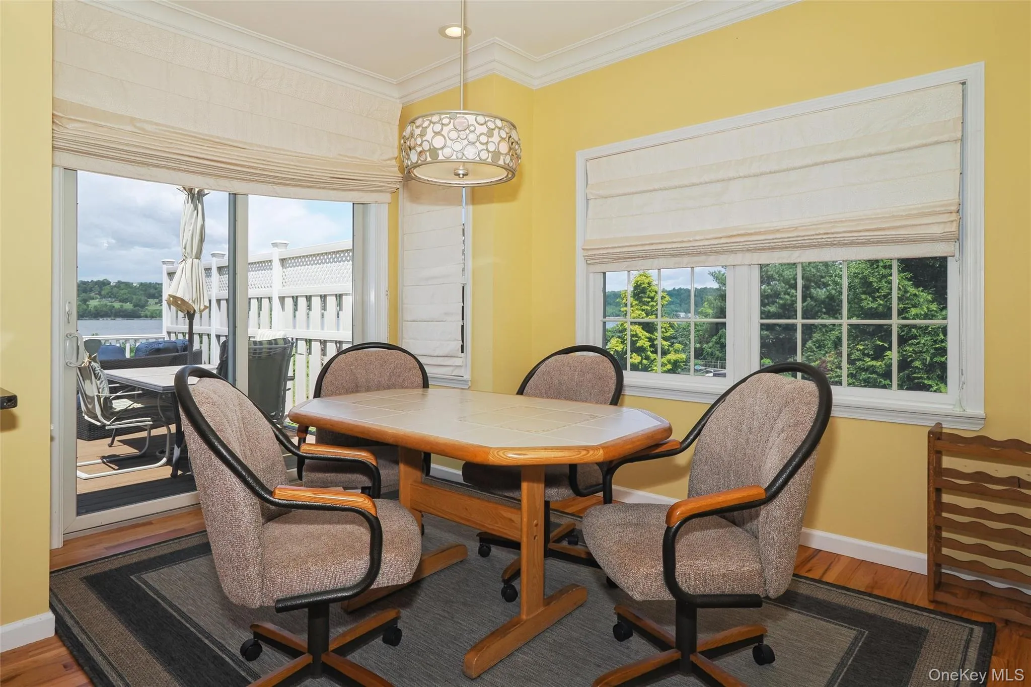 Breakfast area with SGD to oversize deck looking out to the Hudson River. Breakfast area with SGD to oversize deck looking out to the Hudson River.