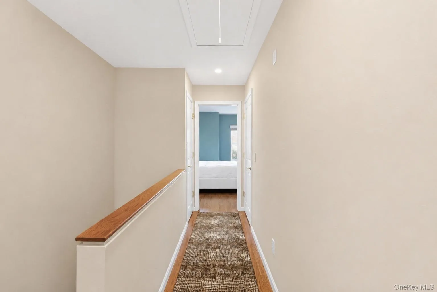 Hallway between bedrooms has laundry closet and linen closet. New recessed light can now also be operated by a switch at the bottom of the stairs. Hallway between bedrooms has laundry closet and linen closet. New recessed light can now also be operated by a switch at the bottom of the stairs.