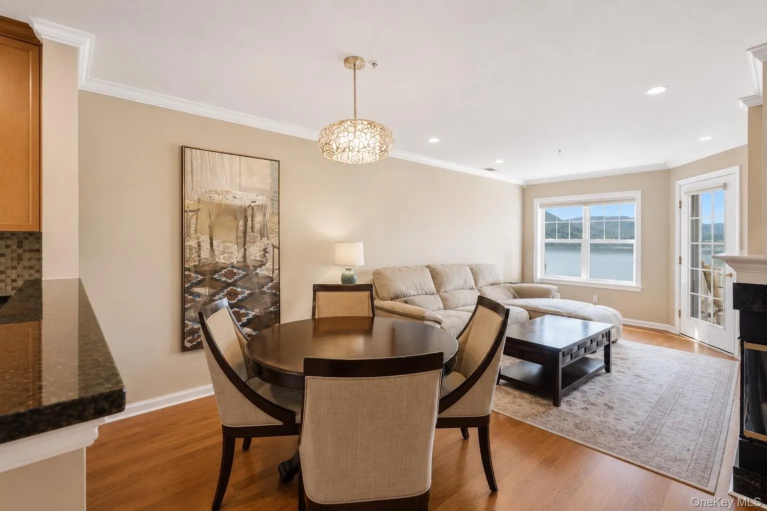 Open-concept living area with beautiful crown molding and unobstructed views of the Hudson River and Bear Mountain Open-concept living area with beautiful crown molding and unobstructed views of the Hudson River and Bear Mountain