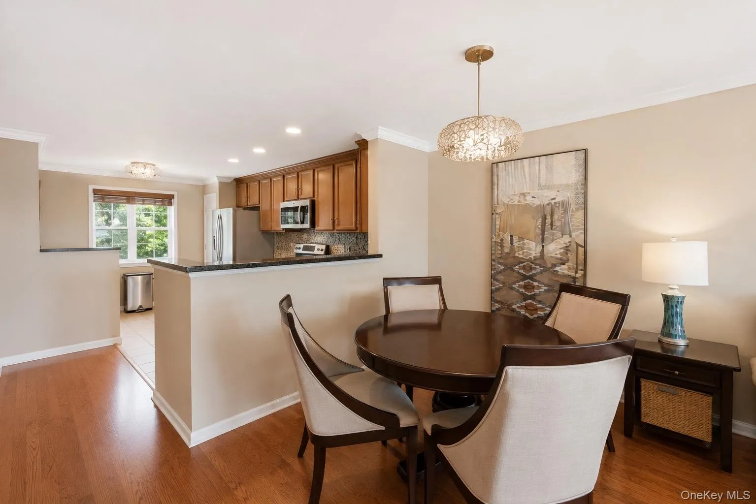 Dining area with decorative chandelier Dining area with decorative chandelier