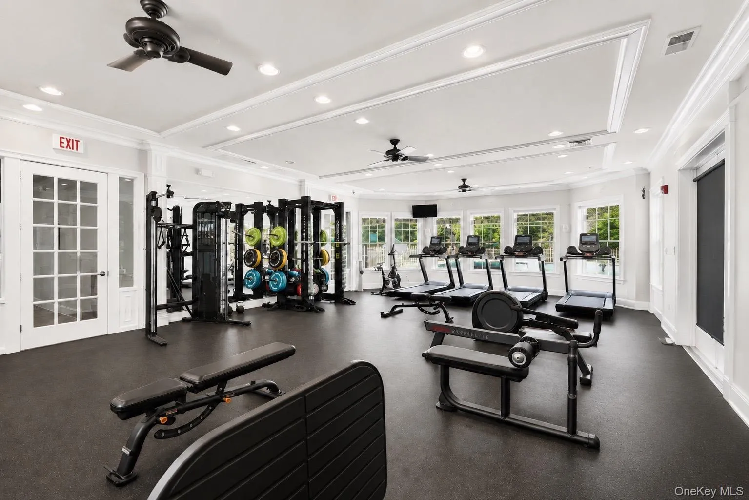 Totally updated fitness center in the clubhouse featuring recessed lighting, tray ceilings, and a series of large windows over looking the pool. Totally updated fitness center in the clubhouse featuring recessed lighting, tray ceilings, and a series of large windows over looking the pool.