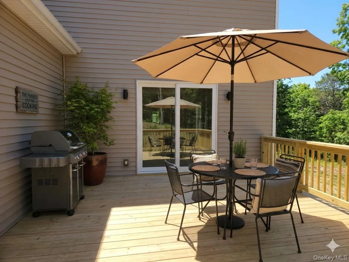 Deck off dining area - PHOTO ALTERED BY AI Deck off dining area - PHOTO ALTERED BY AI