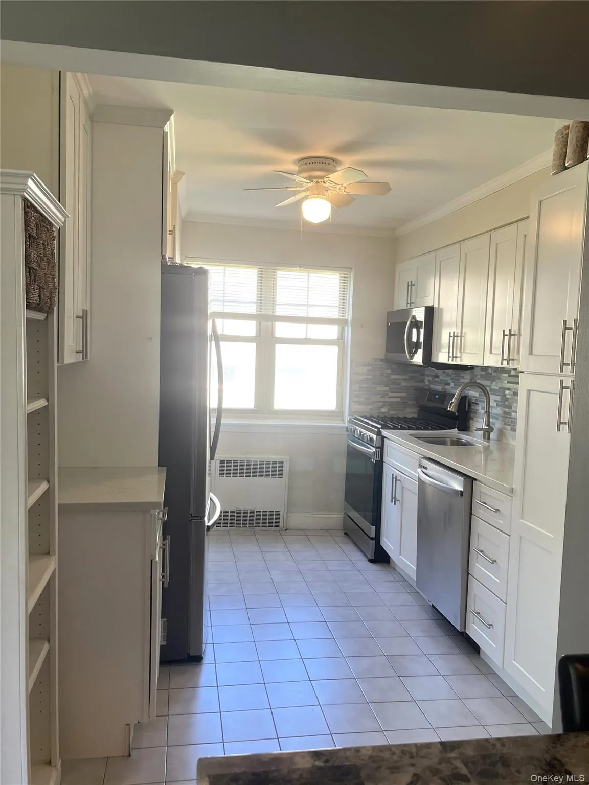 Large Efficiency Kitchen with Stainless Steel Appliances, Plentiful Cabinets & Ceiling Moldings Large Efficiency Kitchen with Stainless Steel Appliances, Plentiful Cabinets & Ceiling Moldings