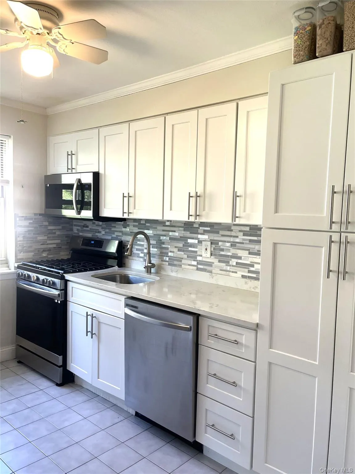 Large Efficiency Kitchen, Quartz Countertops, Tile Backsplash Large Efficiency Kitchen, Quartz Countertops, Tile Backsplash