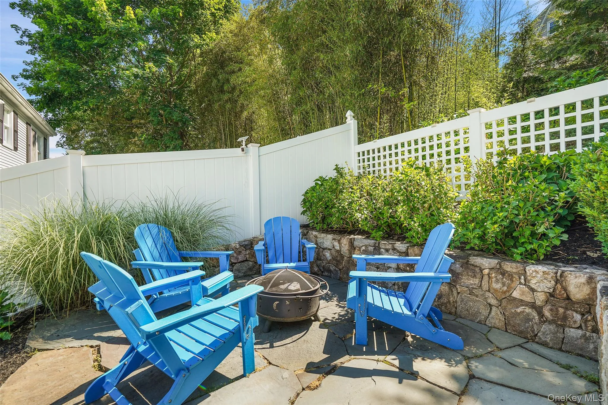 Upper back patio with firepit. Upper back patio with firepit.