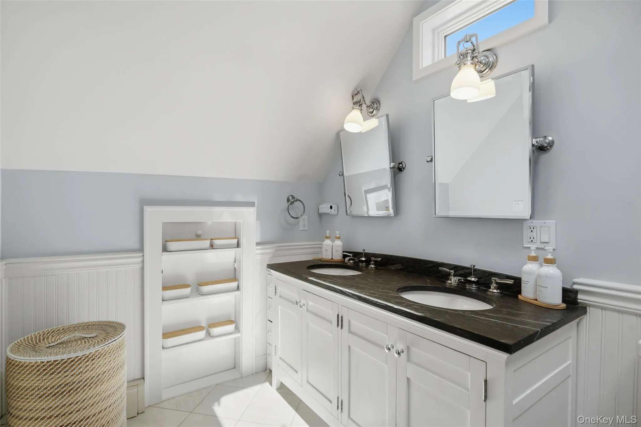 Primary bathroom with double sink, skylight and custom built large shower. Primary bathroom with double sink, skylight and custom built large shower.