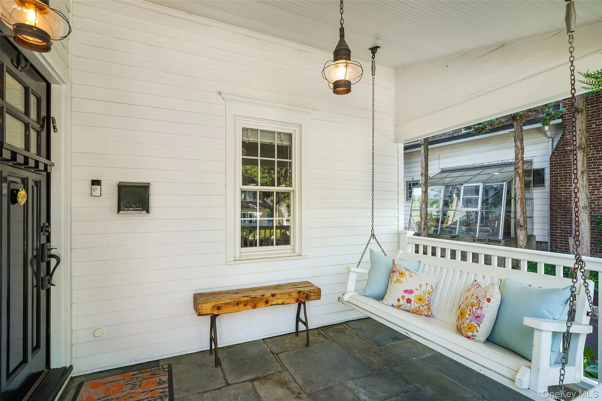 Front porch with bench swing. Front porch with bench swing.