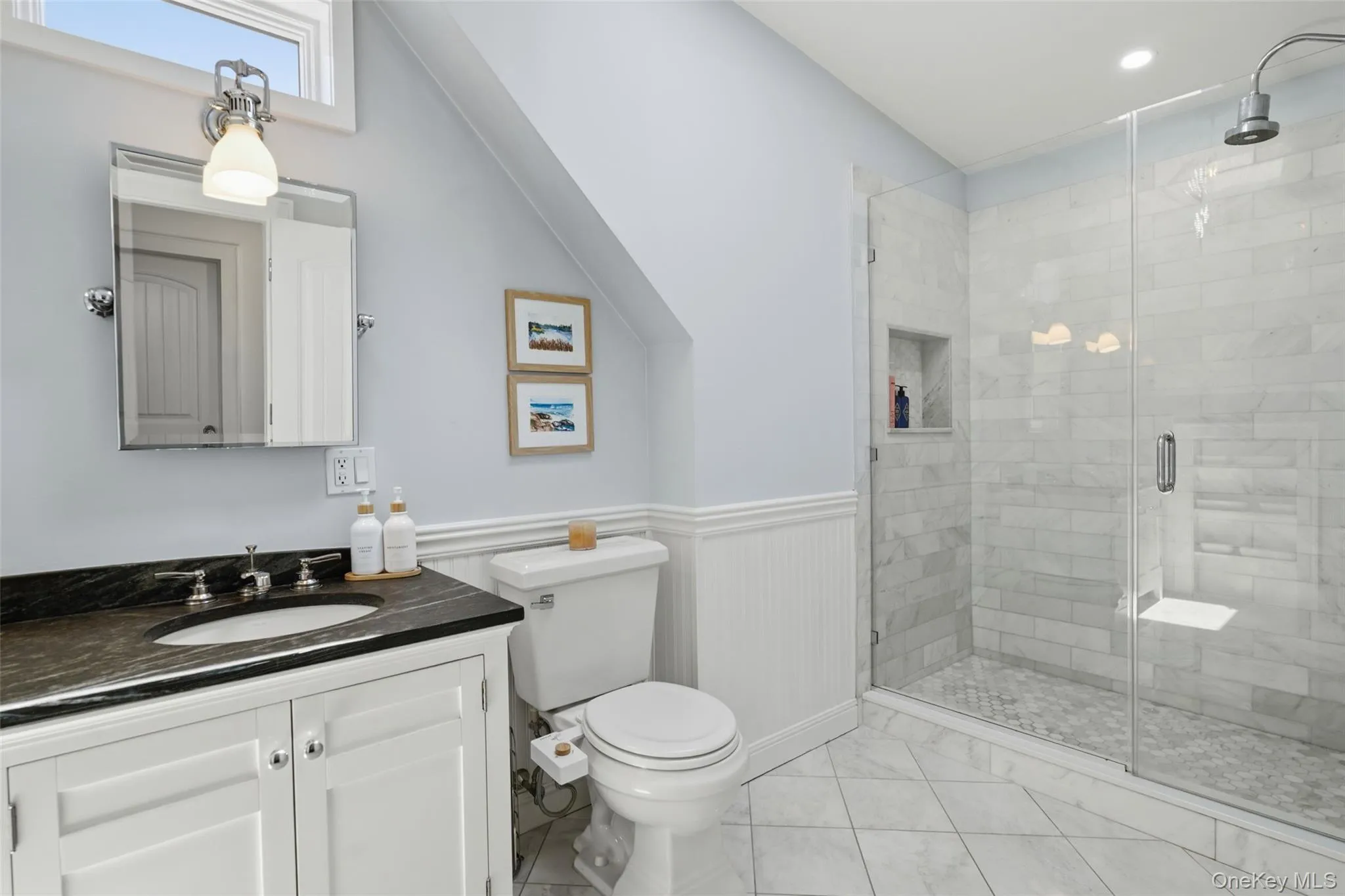 Primary bathroom with double sink, skylight and custom built large shower. Primary bathroom with double sink, skylight and custom built large shower.
