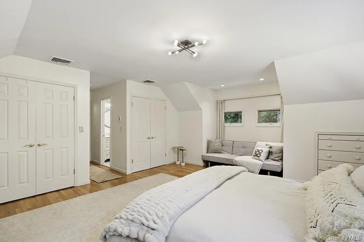 Primary bedroom with two closets and sitting area. Primary bedroom with two closets and sitting area.