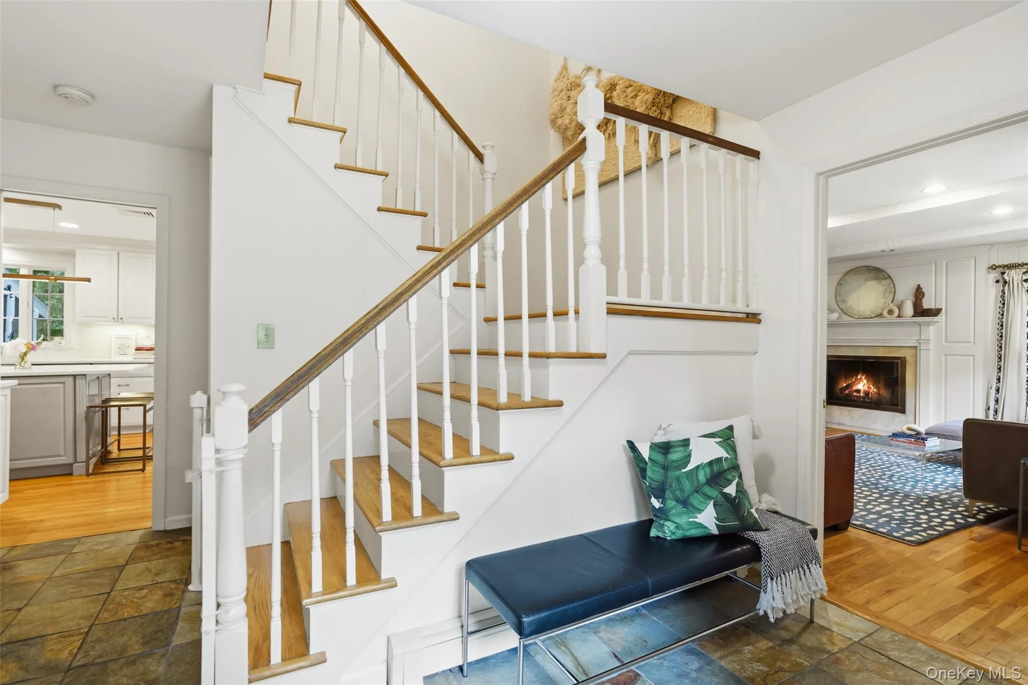 Entryway with open layout to living room, sitting room and kitchen. Entryway with open layout to living room, sitting room and kitchen.