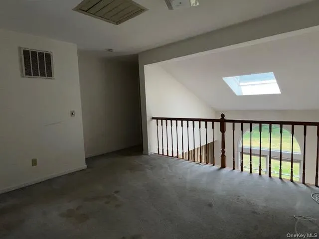 loft overlooks living room with skylight loft overlooks living room with skylight