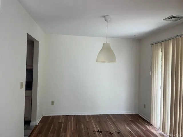 Dining room with slider to back patio Dining room with slider to back patio