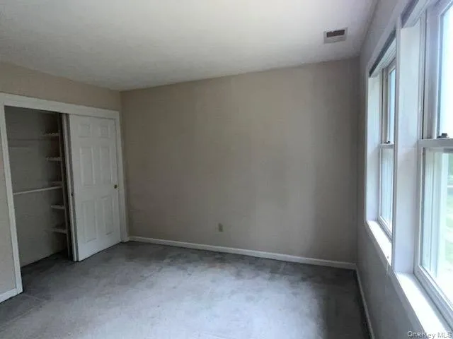 Neutral-toned walls complement the gray carpeting Neutral-toned walls complement the gray carpeting