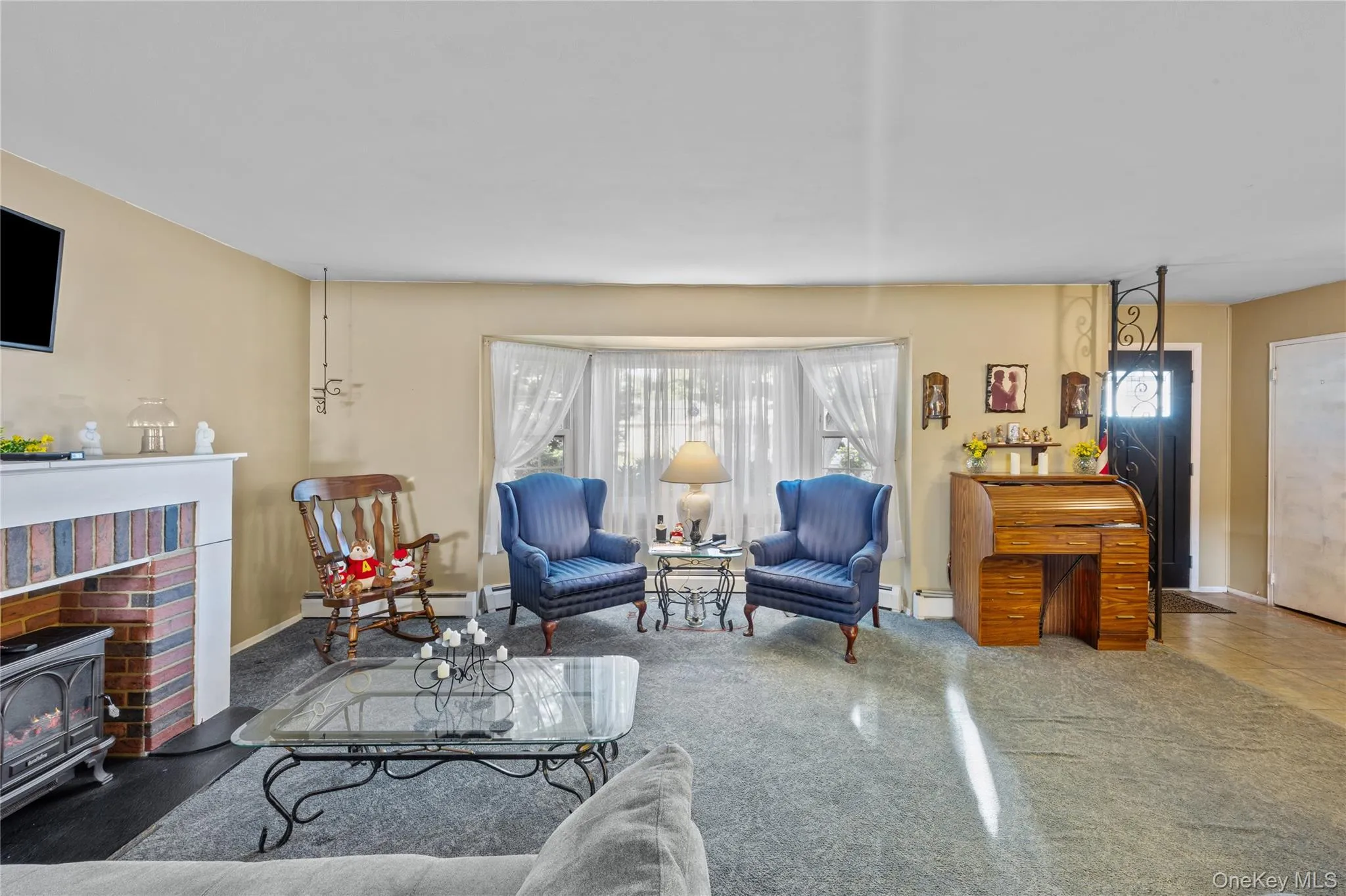 Bright living space featuring a bay window Bright living space featuring a bay window