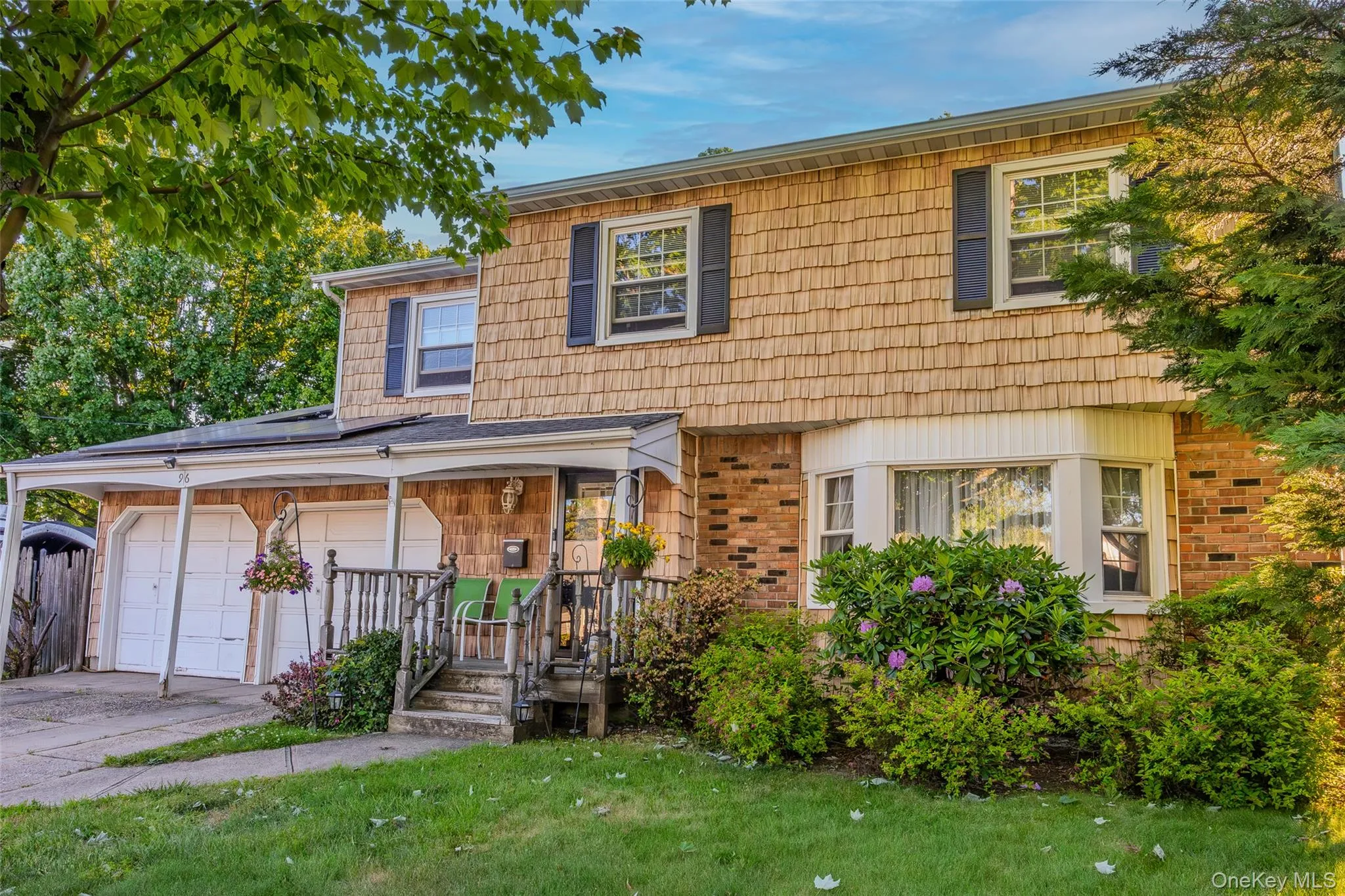 Two-story residence featuring a combination of brick and vinyl siding Two-story residence featuring a combination of brick and vinyl siding