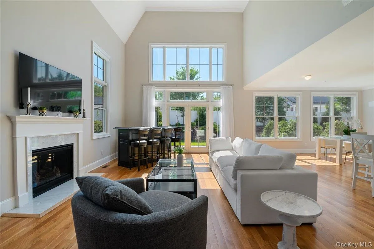 Floor to ceiling windows and gas fireplace. Floor to ceiling windows and gas fireplace.