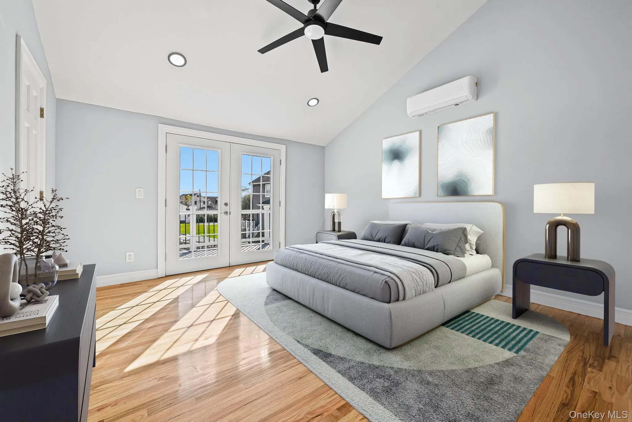 Bedroom with french doors, access to outside, light wood finished floors, a ceiling fan, and an AC wall unit Bedroom with french doors, access to outside, light wood finished floors, a ceiling fan, and an AC wall unit